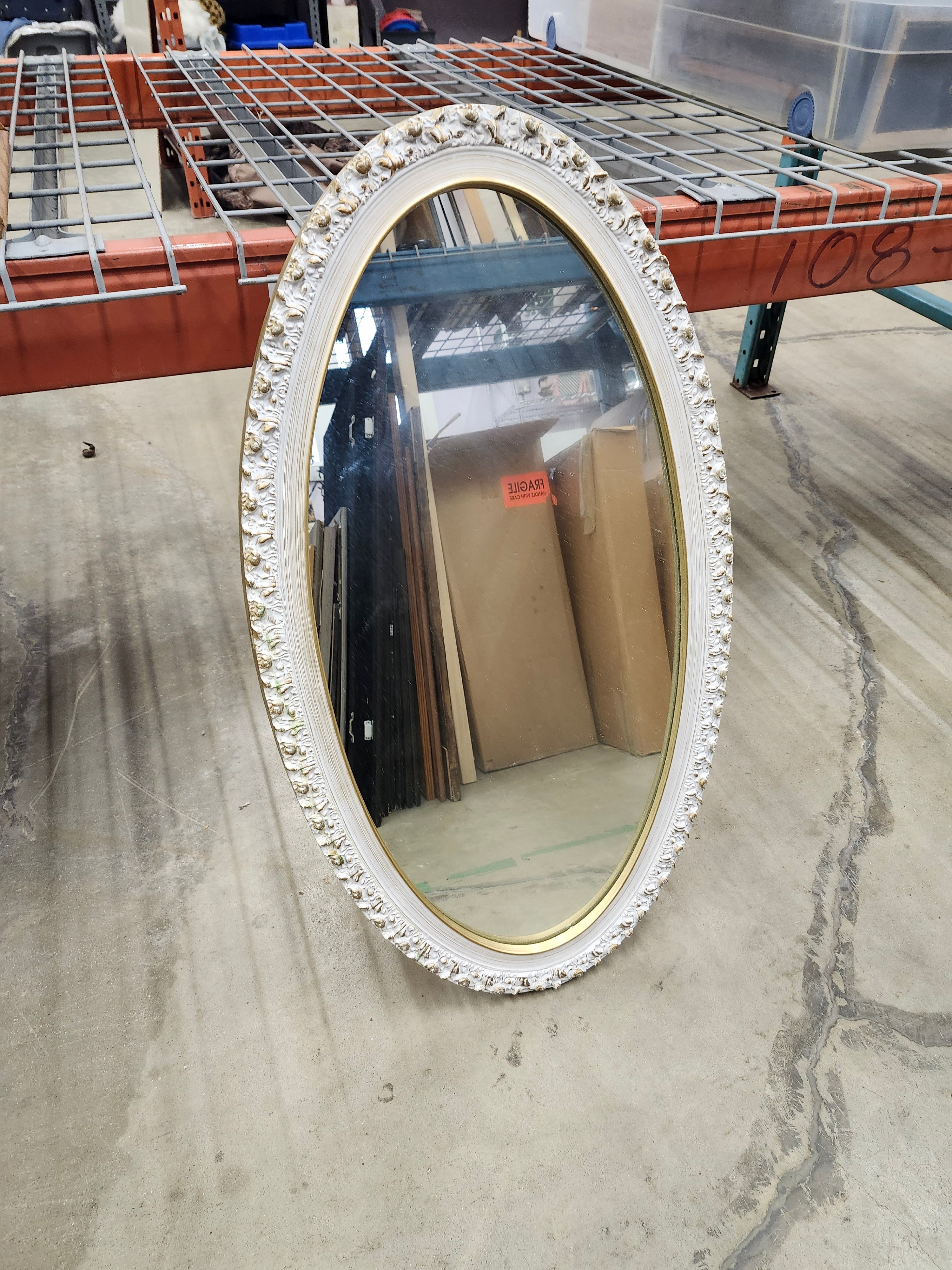 Oval wood framed mirror