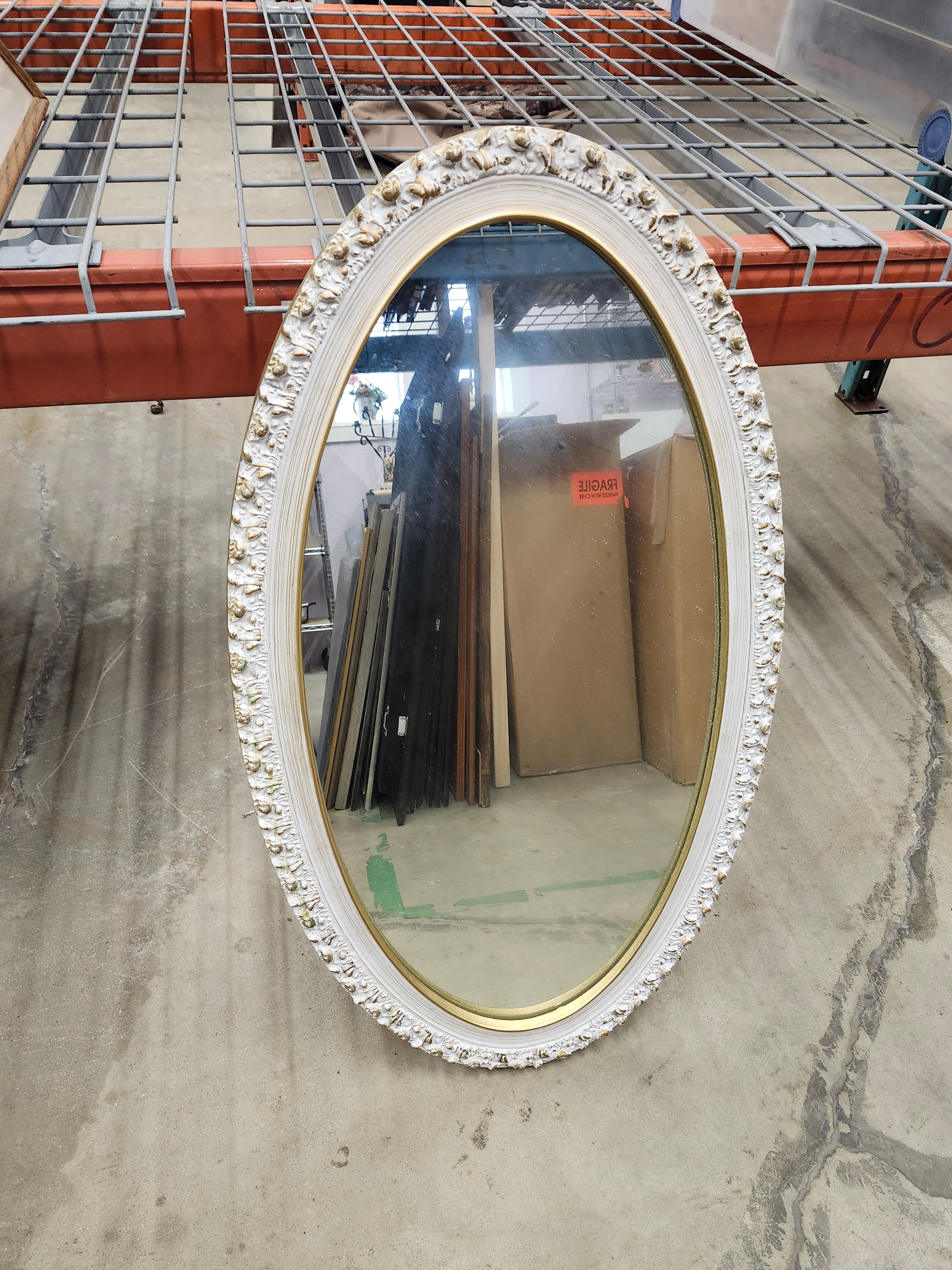 Oval wood framed mirror