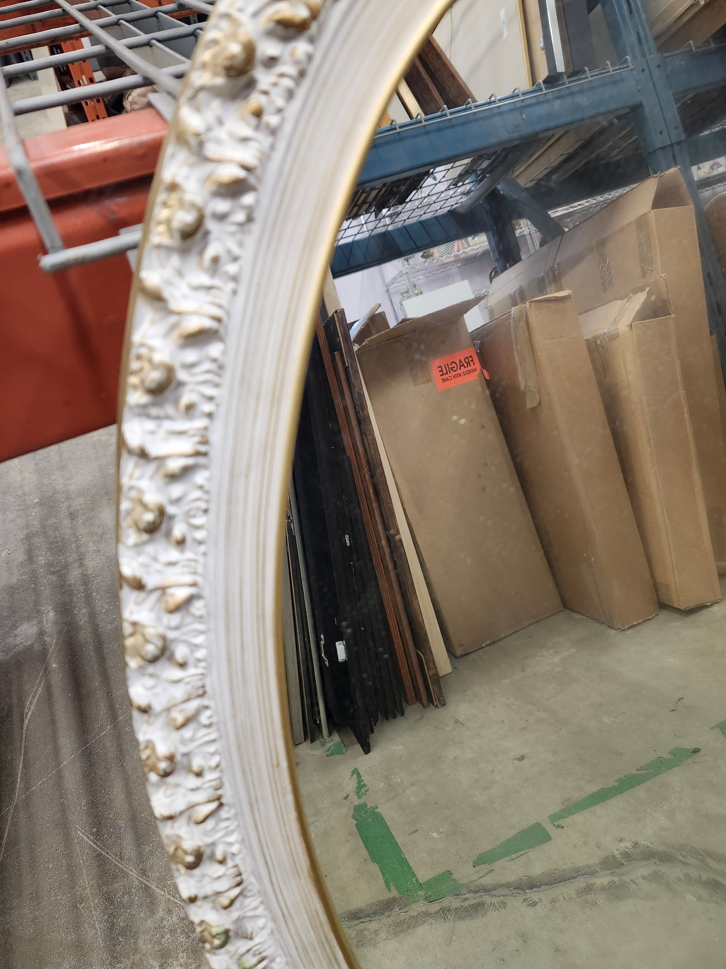 Oval wood framed mirror