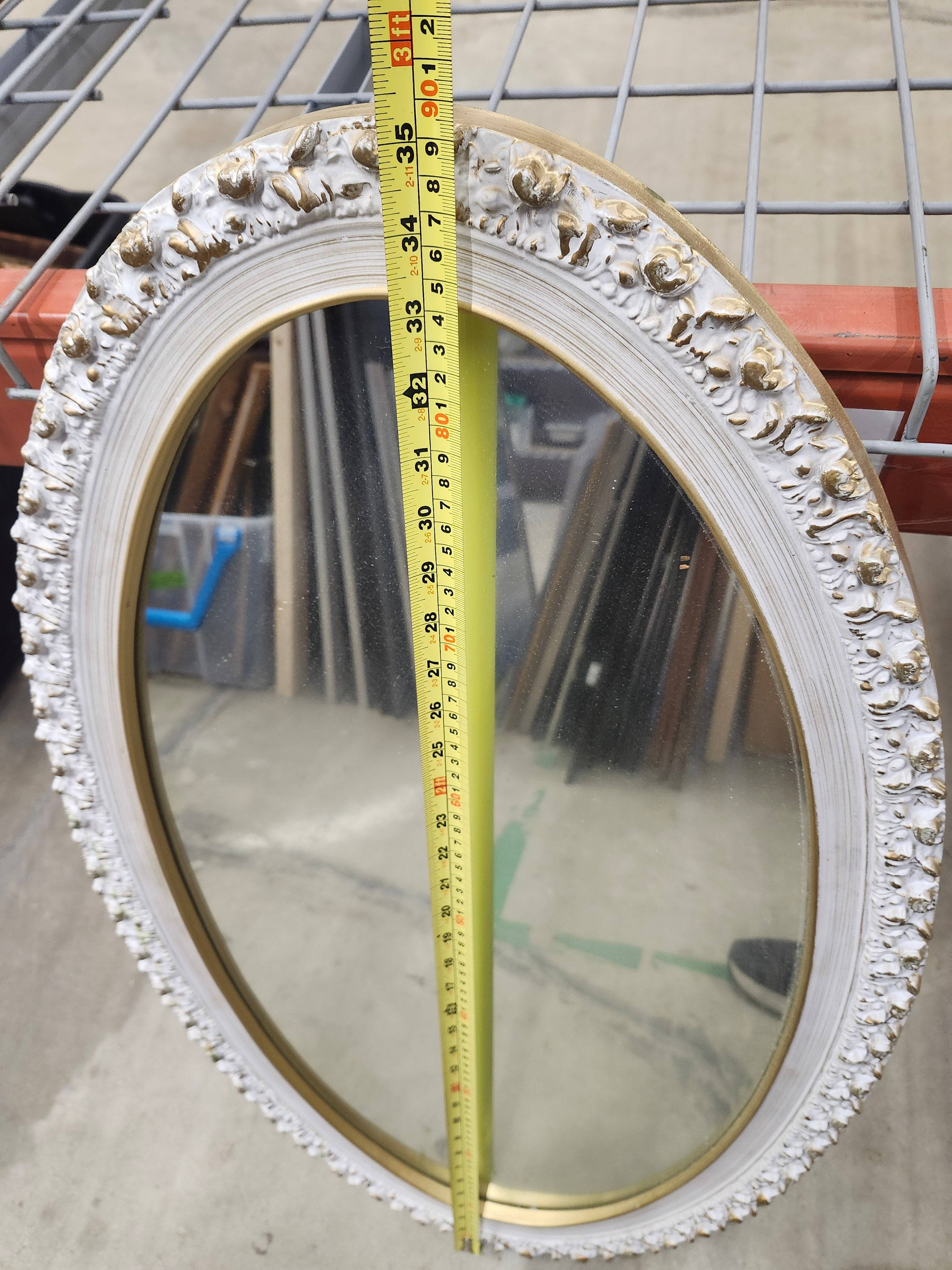Oval wood framed mirror