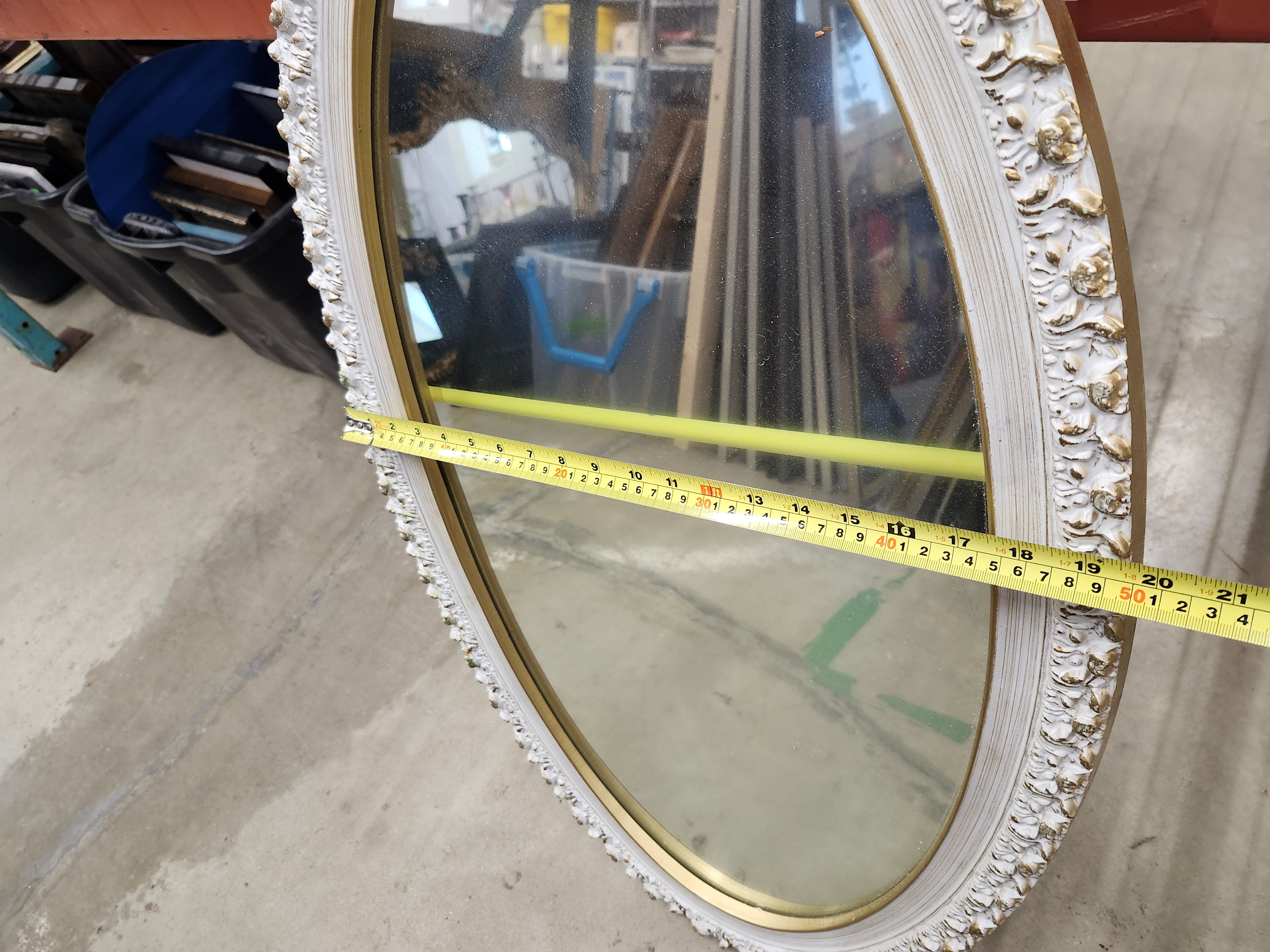 Oval wood framed mirror