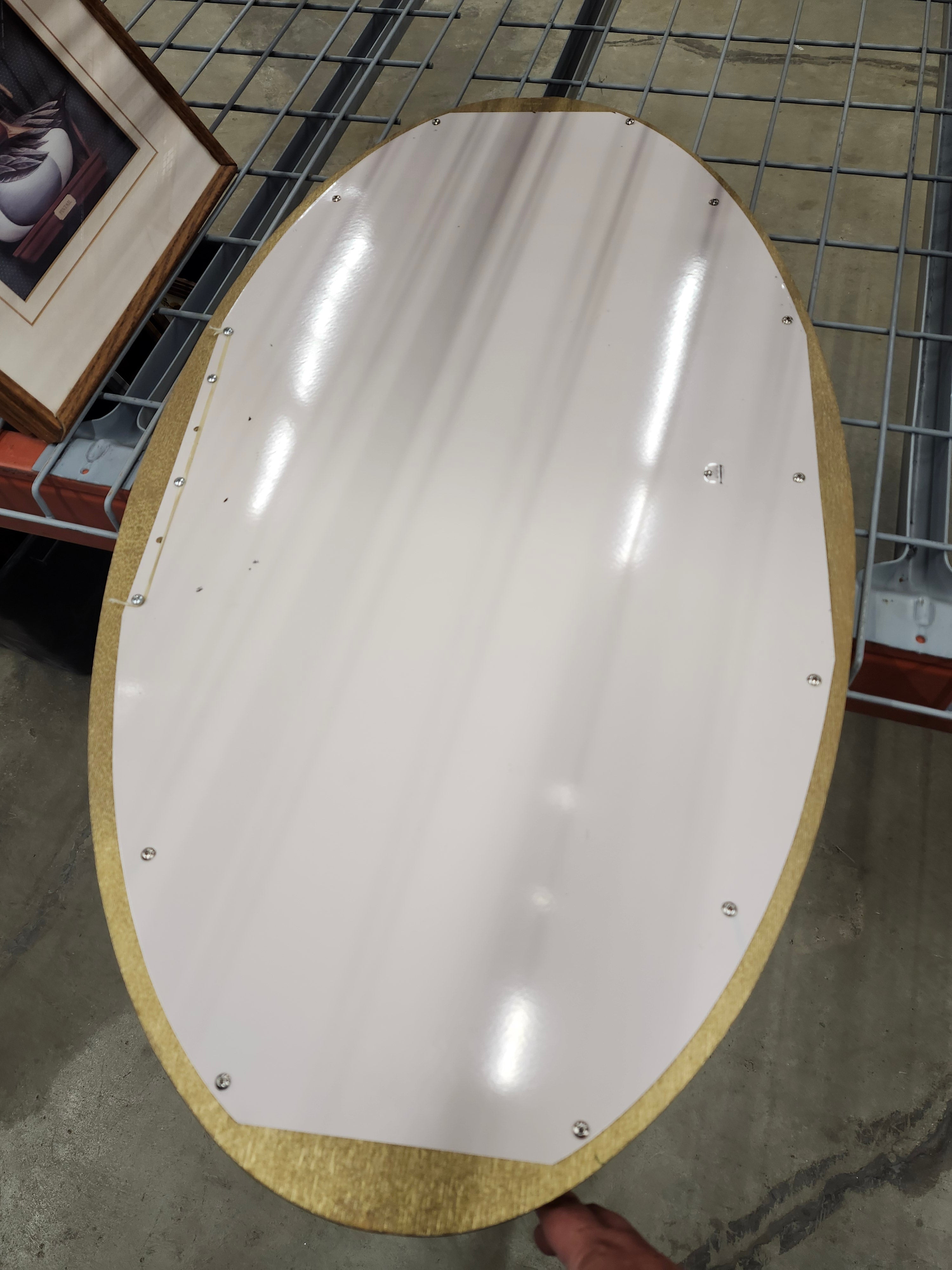 Oval wood framed mirror