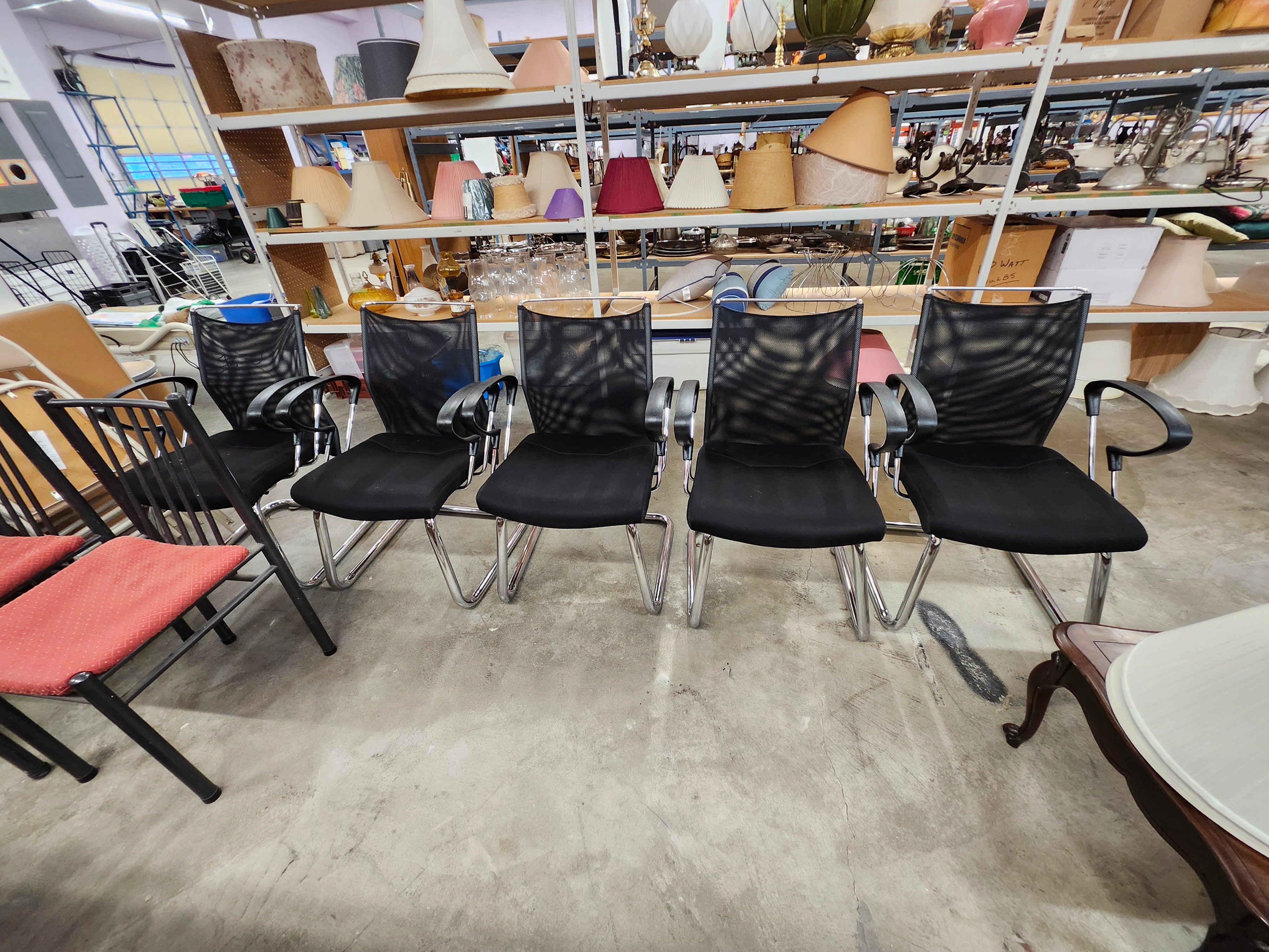 5 black office chairs