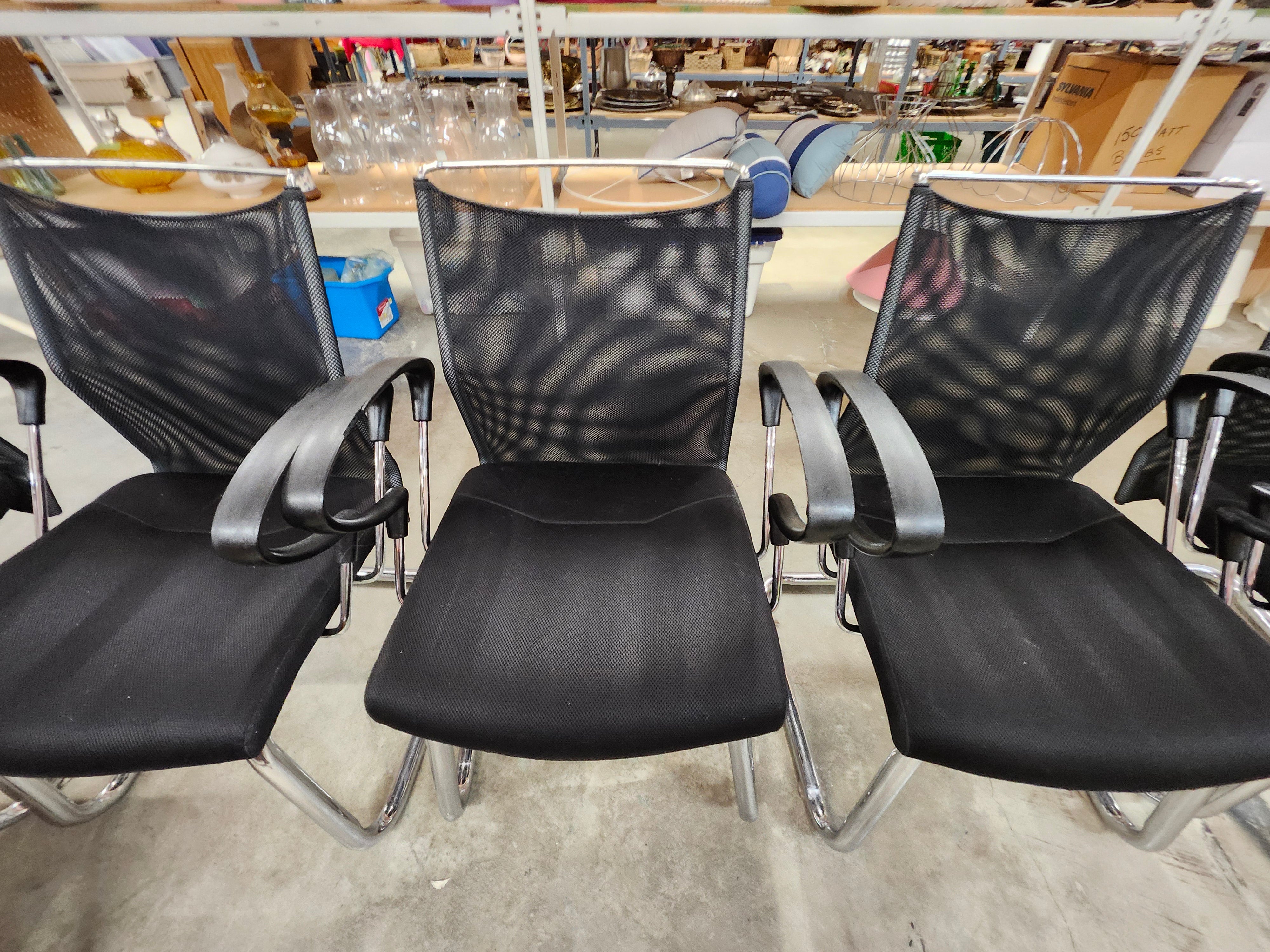 5 black office chairs