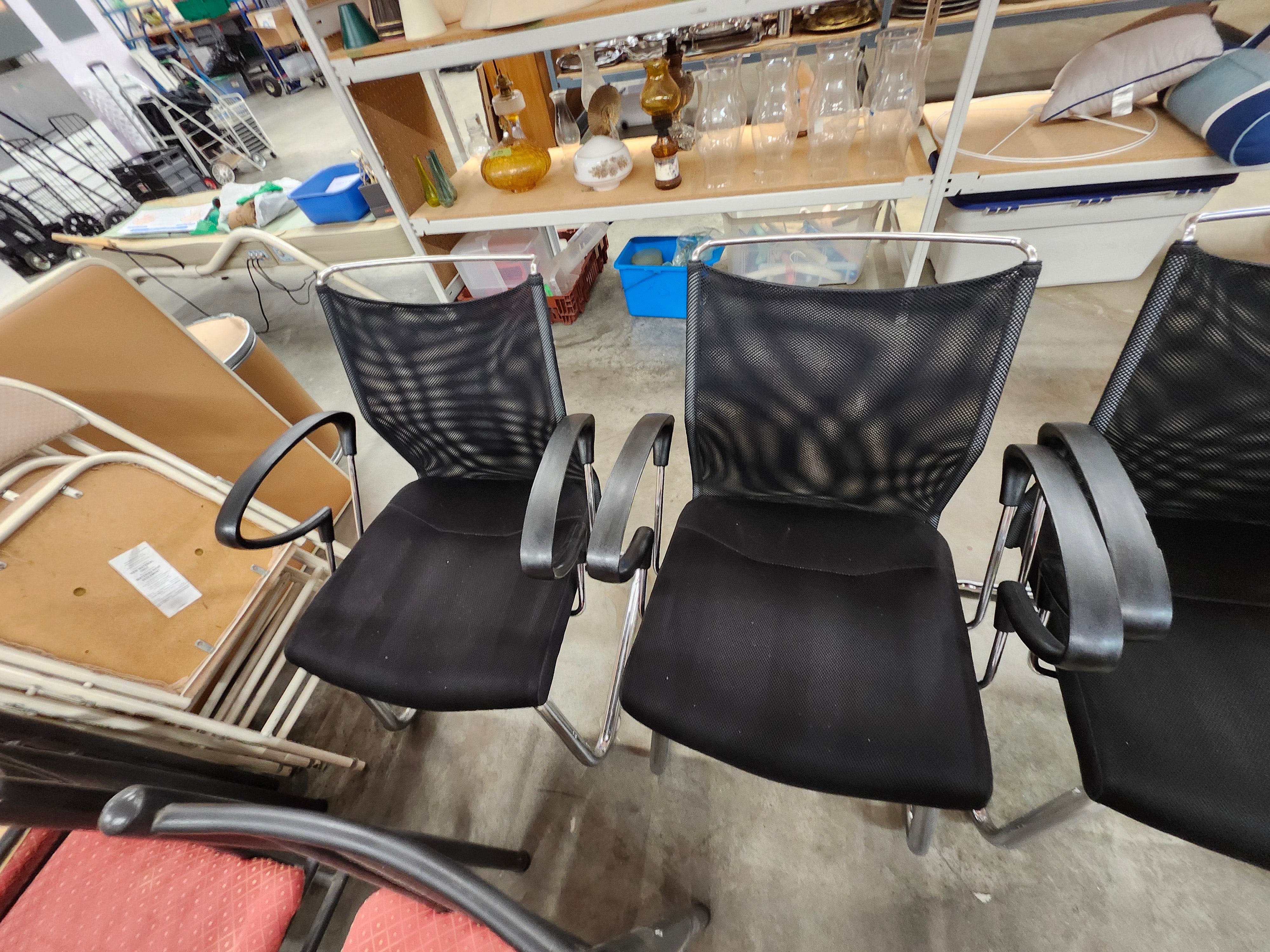 5 black office chairs