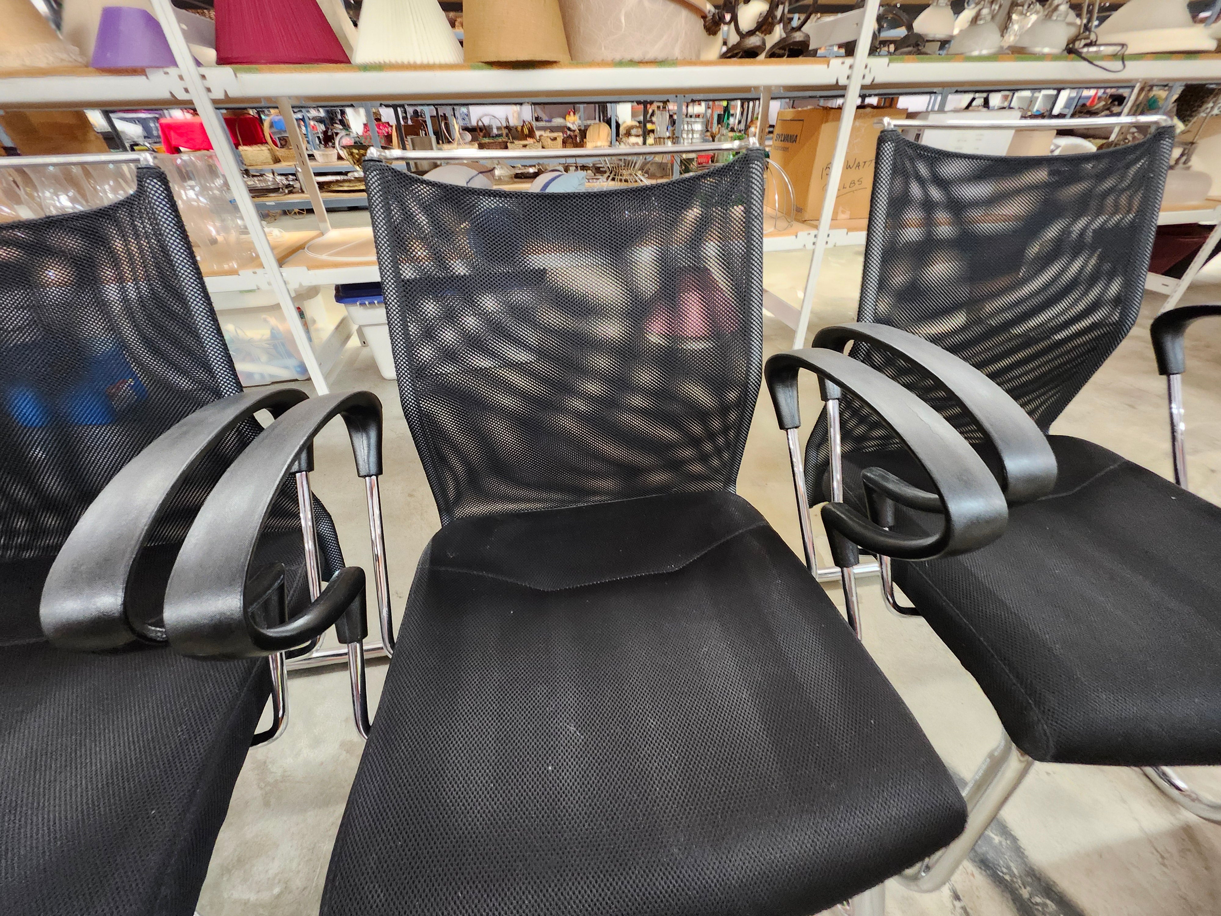 5 black office chairs