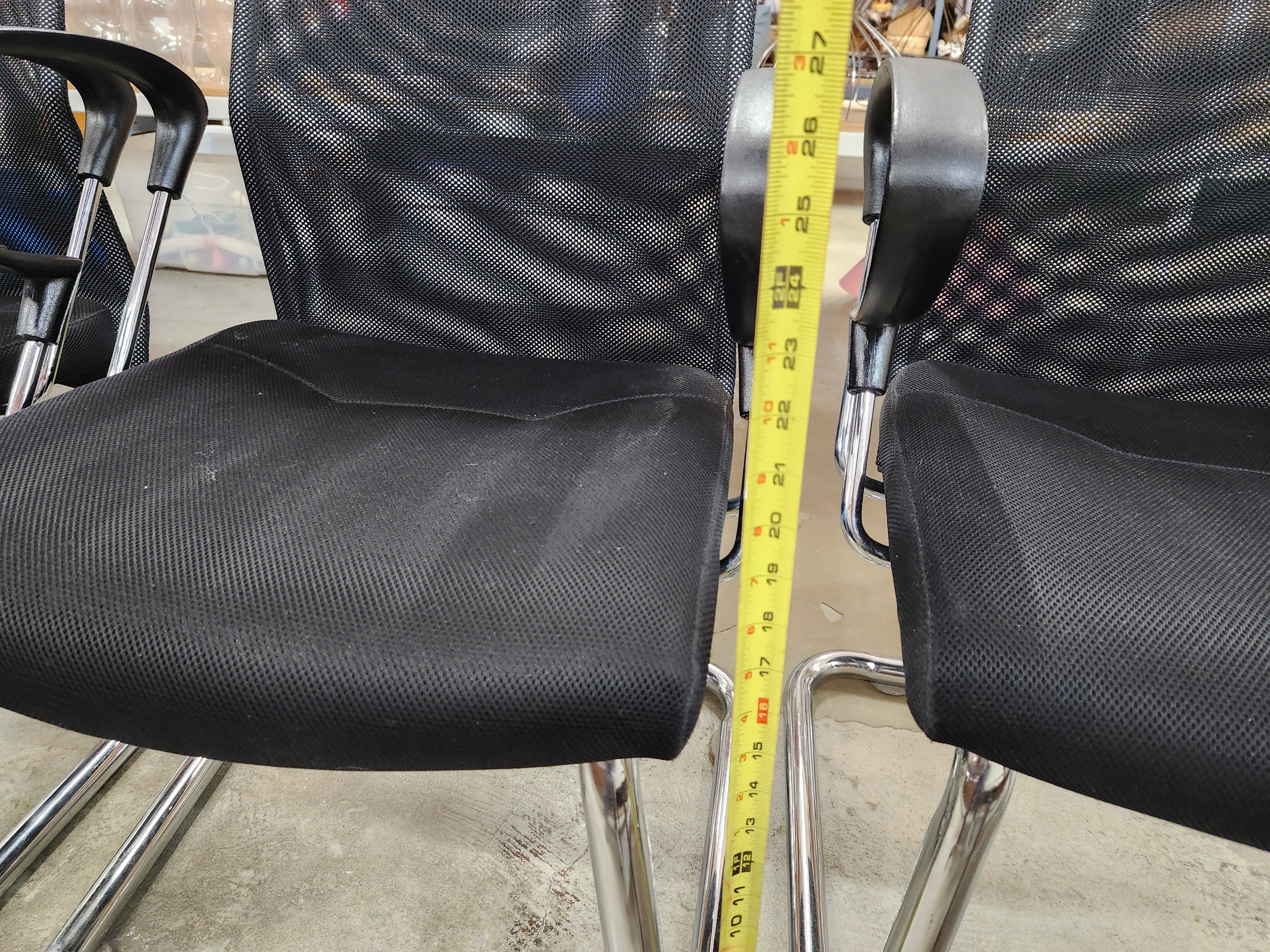 5 black office chairs