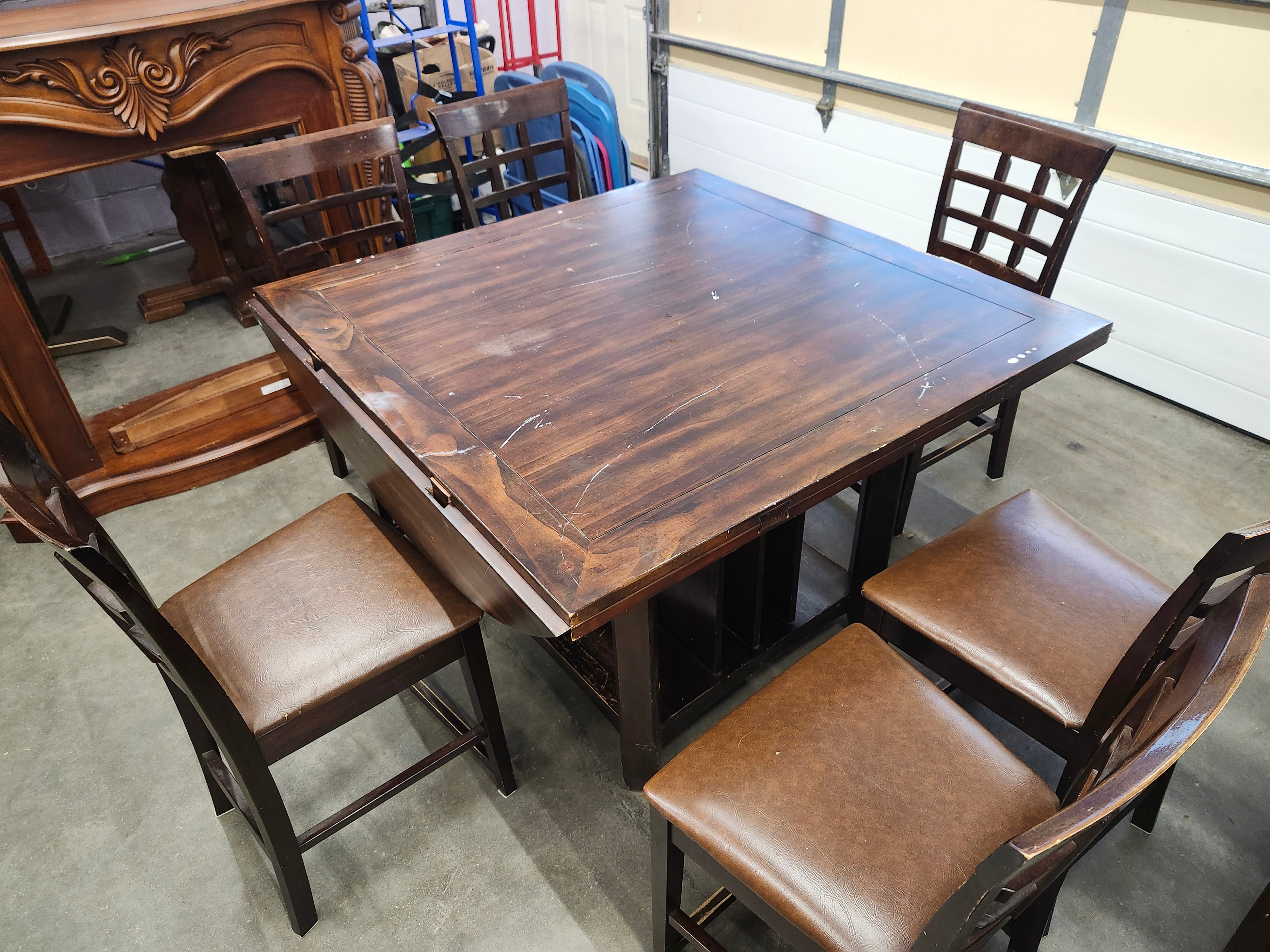 Dining set with 4 drop sides on each corner & 6 chairs with storage underneath table