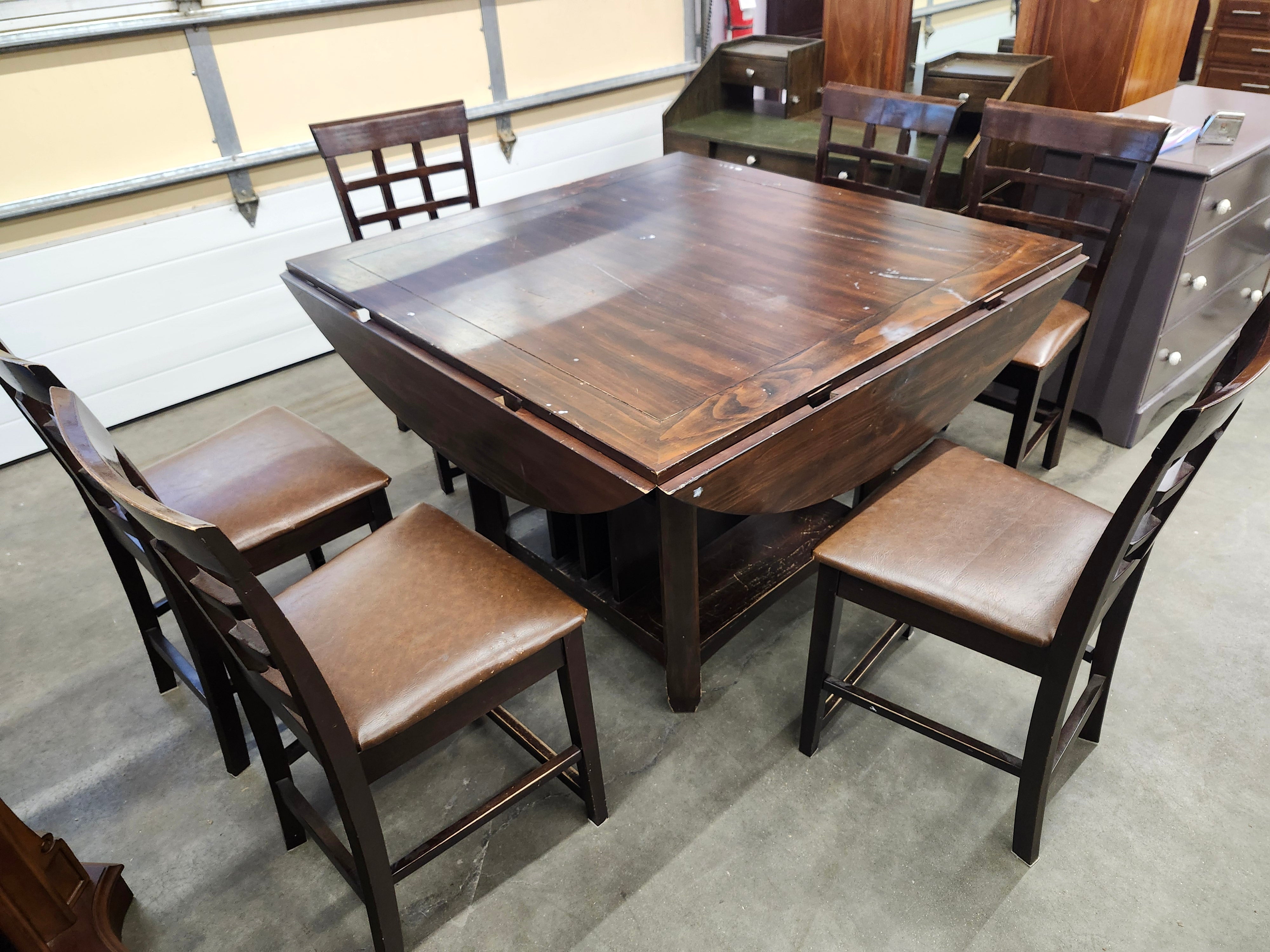Dining set with 4 drop sides on each corner & 6 chairs with storage underneath table