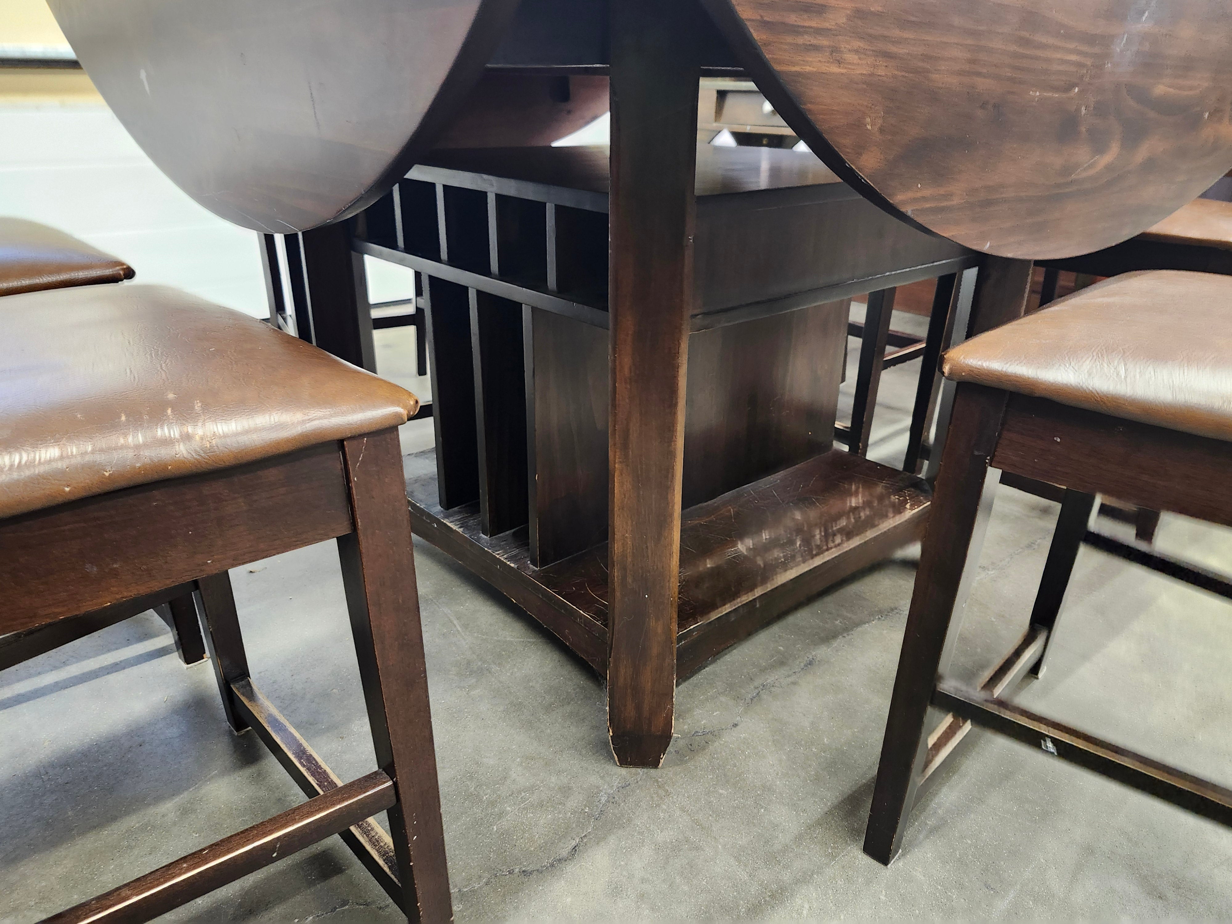 Dining set with 4 drop sides on each corner & 6 chairs with storage underneath table