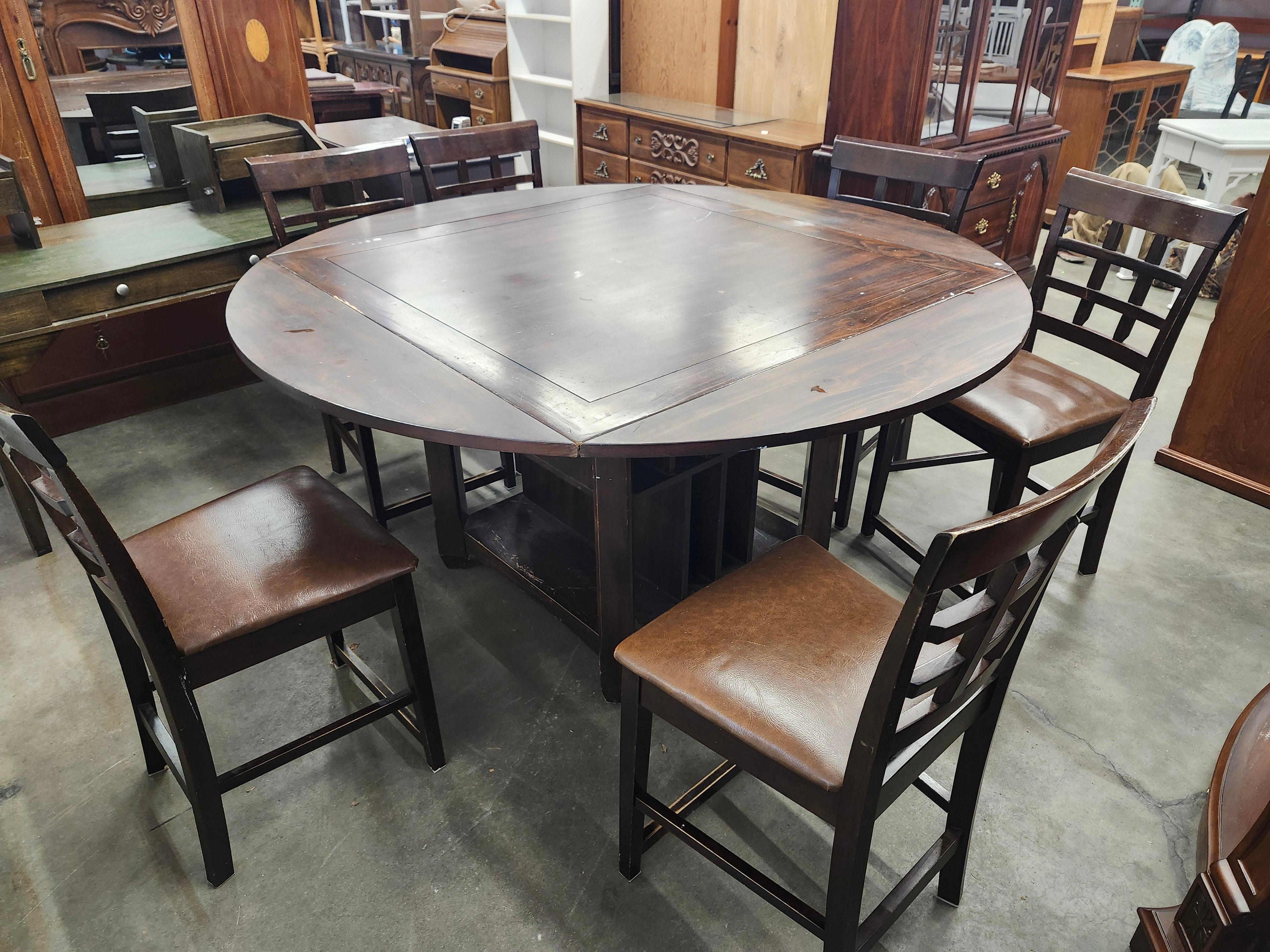 Dining set with 4 drop sides on each corner & 6 chairs with storage underneath table