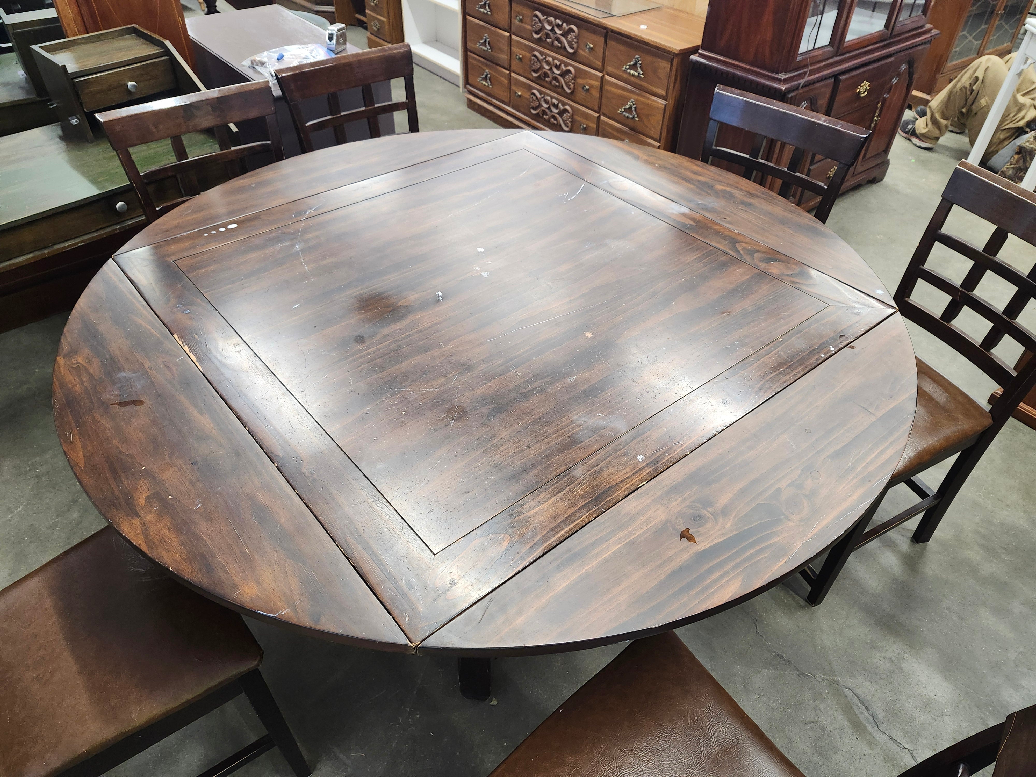 Dining set with 4 drop sides on each corner & 6 chairs with storage underneath table