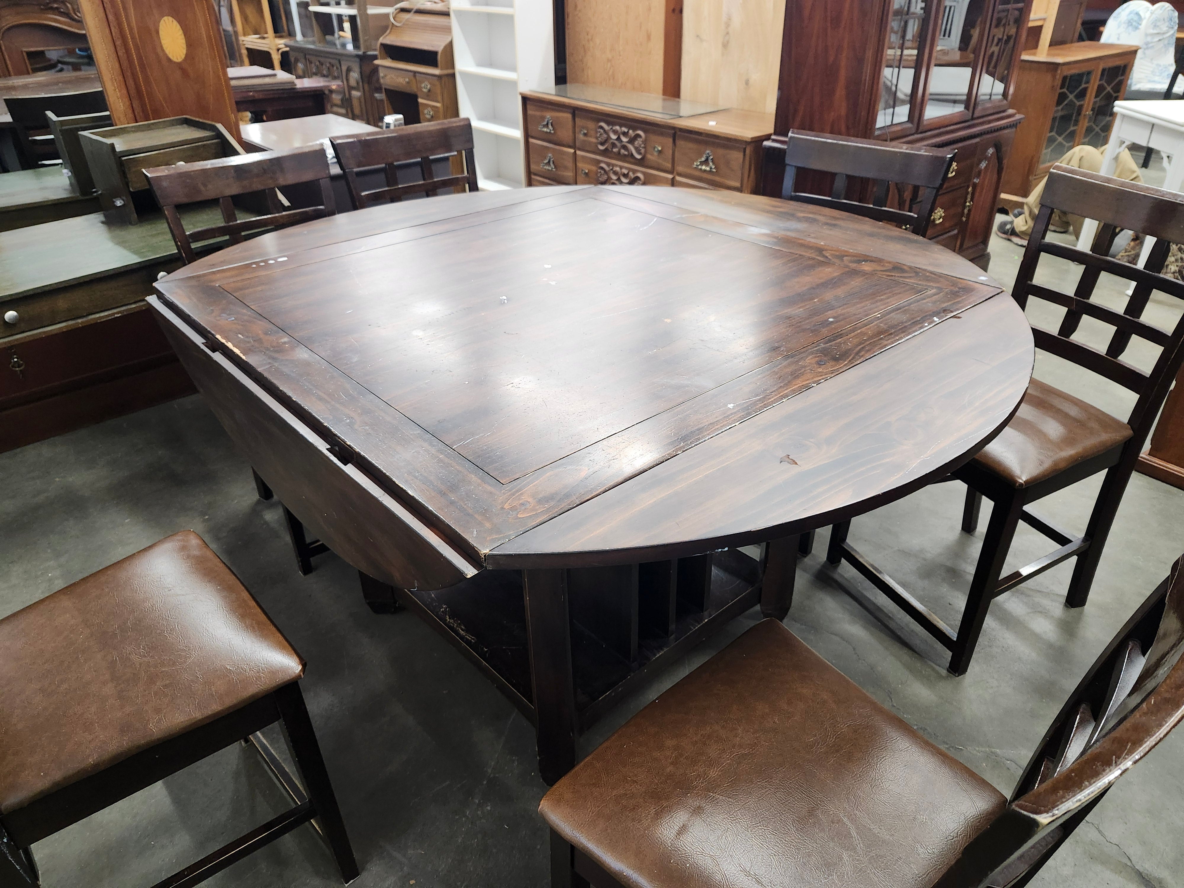 Dining set with 4 drop sides on each corner & 6 chairs with storage underneath table