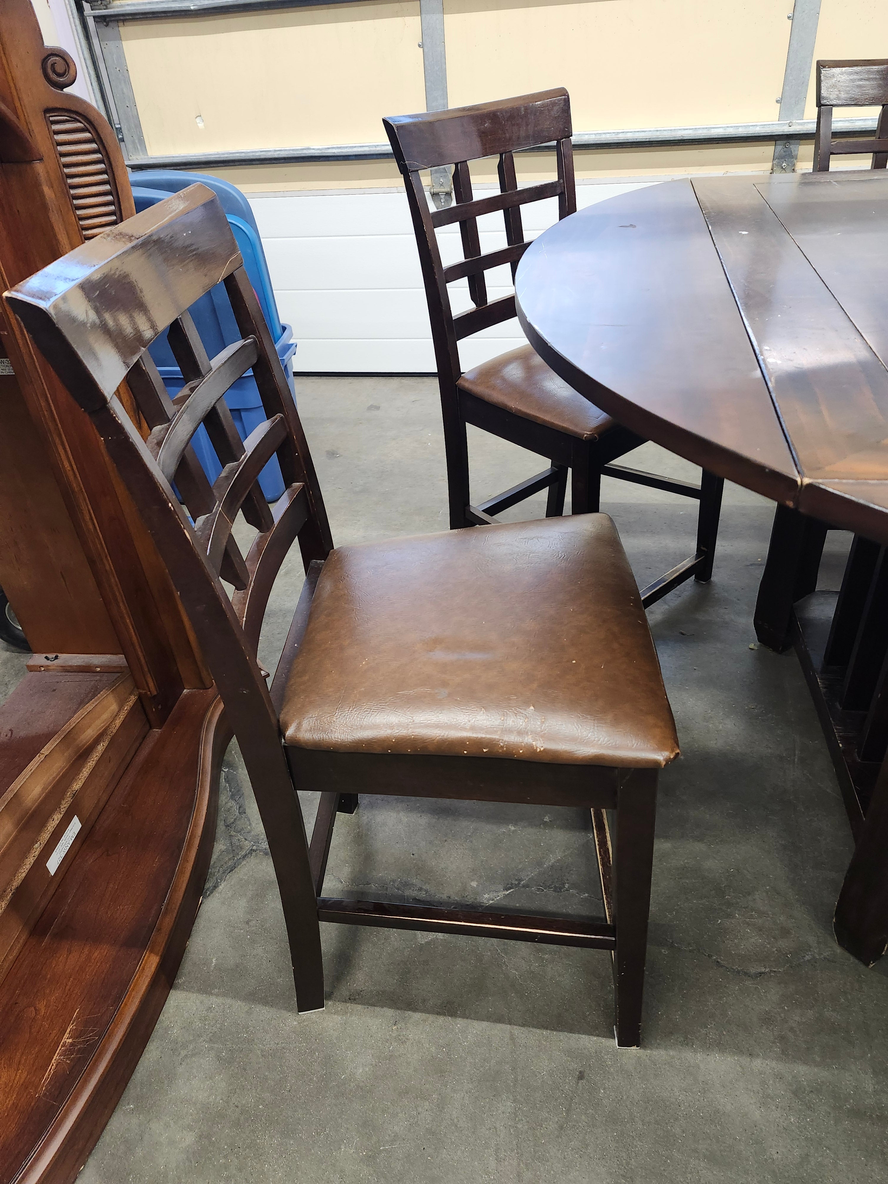Dining set with 4 drop sides on each corner & 6 chairs with storage underneath table