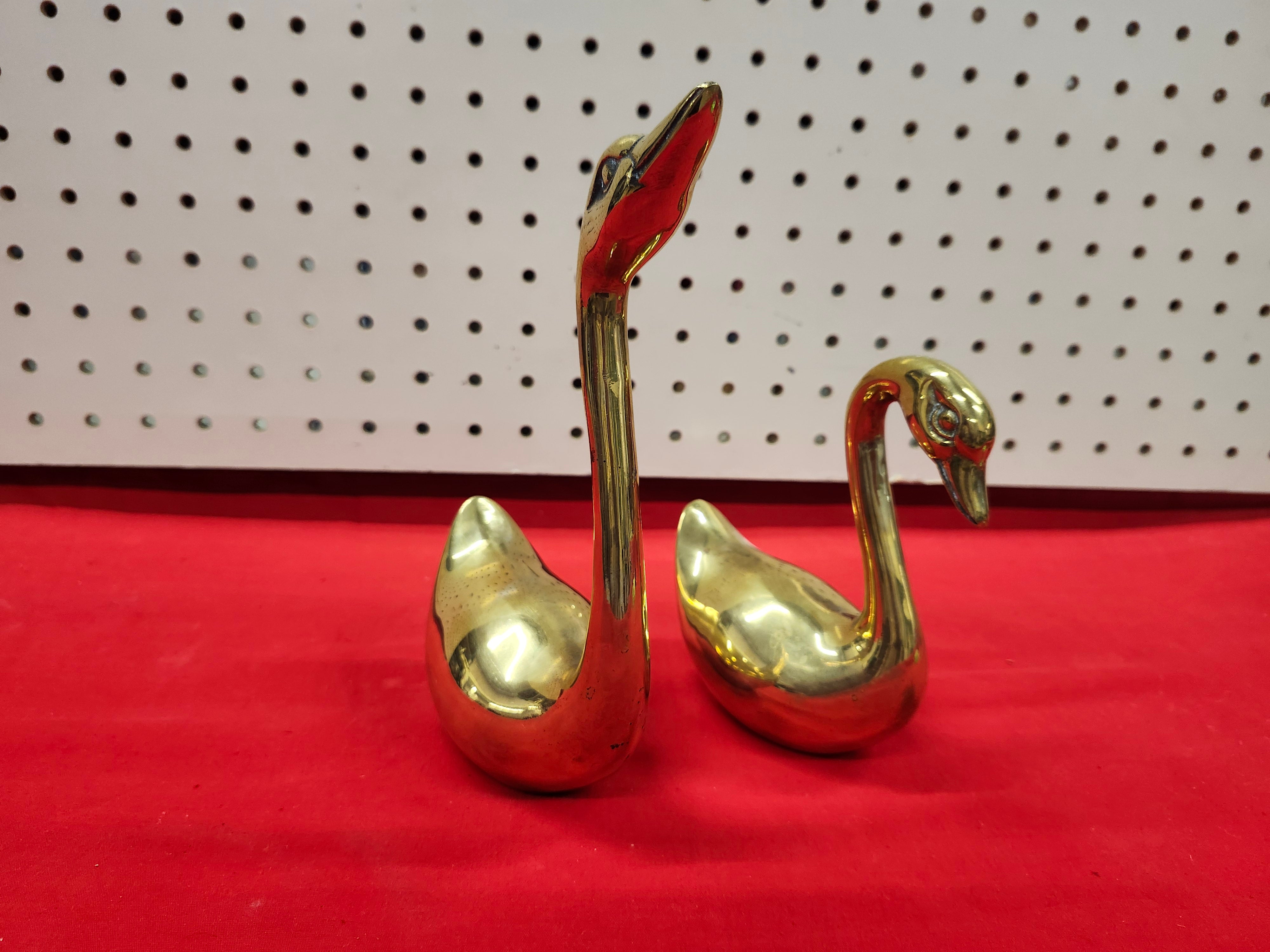 Brass swans