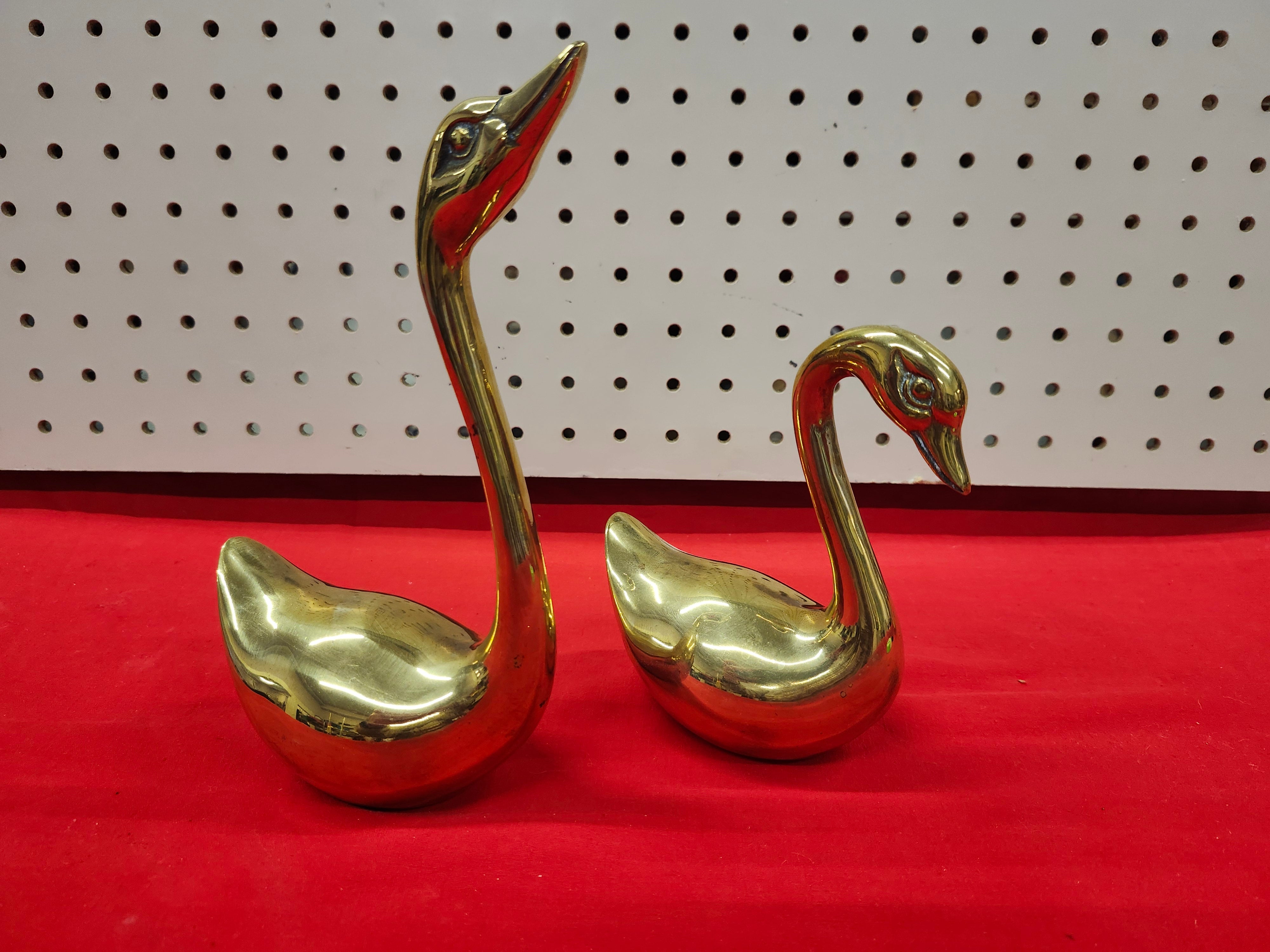 Brass swans
