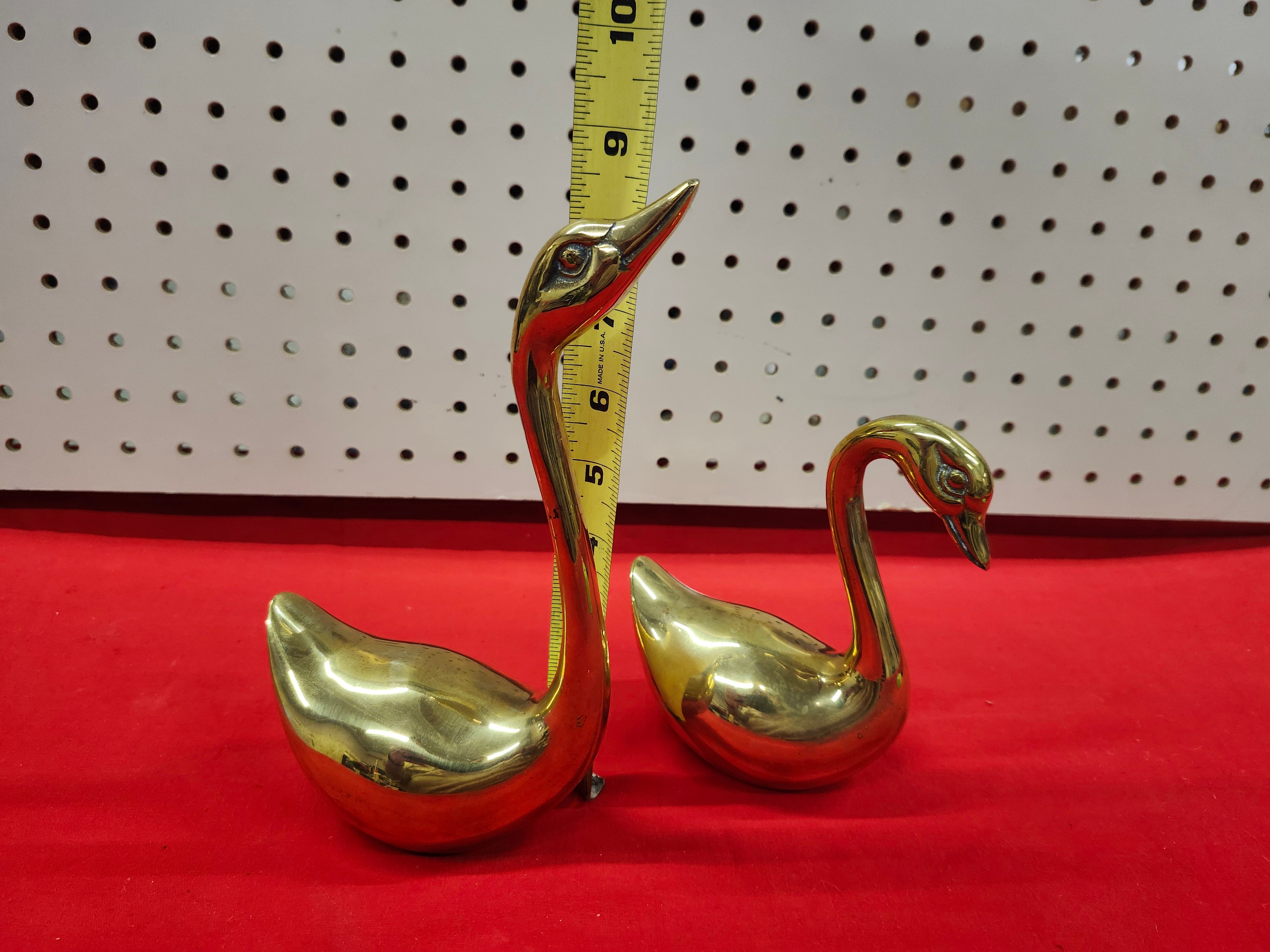 Brass swans