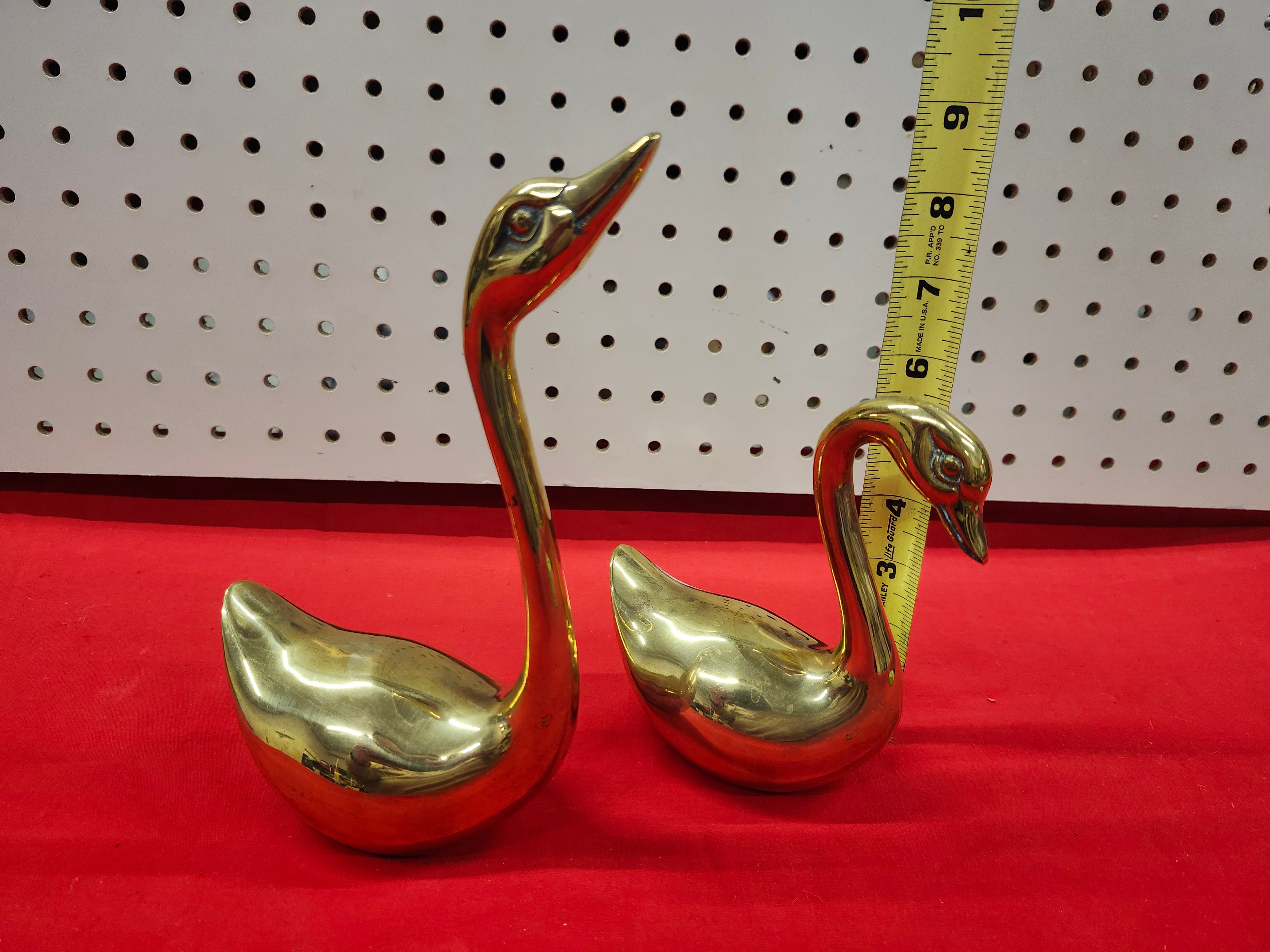 Brass swans
